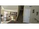 Inviting entryway featuring a staircase and seamless transition to the living and kitchen areas at 11232 N 152Nd Ln, Surprise, AZ 85379