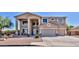 Two-story house with a large driveway and landscaped front yard at 11232 N 152Nd Ln, Surprise, AZ 85379