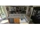 Gourmet kitchen with granite countertops, stainless steel appliances, and an island bar with drink fridge at 11232 N 152Nd Ln, Surprise, AZ 85379