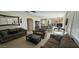 Comfortable living room with a fireplace and wet bar, ideal for relaxation and entertaining at 11232 N 152Nd Ln, Surprise, AZ 85379