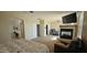 A main bedroom offers a fireplace, carpeted floors and ensuite bathroom for added convenience and privacy at 11232 N 152Nd Ln, Surprise, AZ 85379