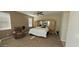 Spacious main bedroom with a ceiling fan, accent chair, and a large mirrored wardrobe at 11232 N 152Nd Ln, Surprise, AZ 85379