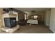 Expansive main bedroom with a cozy fireplace, ceiling fan, and a large mirrored wardrobe at 11232 N 152Nd Ln, Surprise, AZ 85379