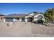 Single-story home with solar panels and landscaped front yard at 12338 W Morning Dove Dr, Sun City West, AZ 85375