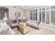 Light and airy living room with white sofas and large windows at 14026 S 34Th St, Phoenix, AZ 85044