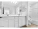 Bathroom featuring a dual sink vanity, modern fixtures, and a separate shower and toilet area at 14670 W Sand Hills Rd, Surprise, AZ 85387