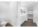 Bathroom with wood floors, a vanity with sink, and a toilet at 14670 W Sand Hills Rd, Surprise, AZ 85387