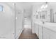 Bright bathroom featuring a walk-in shower with glass enclosure and a large double vanity at 14670 W Sand Hills Rd, Surprise, AZ 85387
