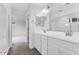 Bright bathroom featuring a walk-in shower and a large double vanity with a wide mirror at 14670 W Sand Hills Rd, Surprise, AZ 85387