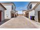 Modern townhouse exterior featuring two-story design, stucco finish, and private garage at 14670 W Sand Hills Rd, Surprise, AZ 85387