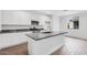 Open kitchen featuring granite countertops, stainless steel appliances, and a large central island at 14670 W Sand Hills Rd, Surprise, AZ 85387