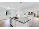 Spacious kitchen island featuring granite countertops, sink, and modern finishes at 14670 W Sand Hills Rd, Surprise, AZ 85387
