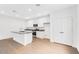 Bright kitchen with a large center island, stainless steel appliances, and modern white cabinets at 14670 W Sand Hills Rd, Surprise, AZ 85387