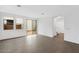 Spacious living room with wood floors, a sliding glass door, and bright natural light at 14670 W Sand Hills Rd, Surprise, AZ 85387