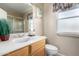 Simple bathroom with single sink, toilet, and shower at 14818 N 103Rd Ave, Sun City, AZ 85351