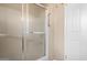 Small bathroom with walk-in shower and grab bar at 14818 N 103Rd Ave, Sun City, AZ 85351