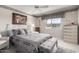 Guest bedroom with queen-size bed and built-in storage at 14818 N 103Rd Ave, Sun City, AZ 85351
