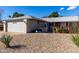 House exterior showcasing a well-maintained front yard and garage at 14818 N 103Rd Ave, Sun City, AZ 85351