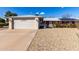 Front view of a single-story house with a two-car garage at 14818 N 103Rd Ave, Sun City, AZ 85351