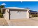 Attached two-car garage with light-colored door at 14818 N 103Rd Ave, Sun City, AZ 85351
