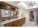 Updated kitchen with wood cabinets and breakfast bar at 14818 N 103Rd Ave, Sun City, AZ 85351