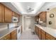 Bright kitchen with wood cabinets, ample counter space, and modern appliances at 14818 N 103Rd Ave, Sun City, AZ 85351
