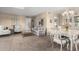 Living and dining area with neutral carpeting and furniture at 14818 N 103Rd Ave, Sun City, AZ 85351