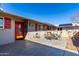Stone patio with a table and chairs, near the front entrance at 14818 N 103Rd Ave, Sun City, AZ 85351