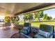Relaxing patio with seating area and view of green space at 14818 N 103Rd Ave, Sun City, AZ 85351