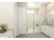 Modern bathroom with walk-in shower and gray tile flooring at 15029 W Gray Fox Trl, Surprise, AZ 85387