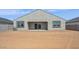Expansive backyard featuring desert landscaping and a covered patio, perfect for outdoor living and entertainment at 1561 E Mason Dr, Casa Grande, AZ 85122