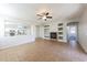 Living area with tile flooring, fireplace, built-ins, and kitchen views at 15930 W Redfield Rd, Surprise, AZ 85379