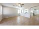 Spacious living room with tile floors and an open kitchen view at 15930 W Redfield Rd, Surprise, AZ 85379