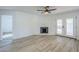 Bright living room with fireplace and French doors leading outside at 1675 N Monterey Dr, Apache Junction, AZ 85120