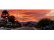 Community view showcasing beautiful sunset and mountain backdrop at 17561 N Saddle Ridge Dr, Surprise, AZ 85374