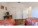 Bedroom with two twin beds, closet, and workspace at 17561 N Saddle Ridge Dr, Surprise, AZ 85374