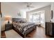 Spacious bedroom with wood-look floors and a ceiling fan at 17561 N Saddle Ridge Dr, Surprise, AZ 85374