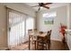 Dining area with wood table, chairs, and access to patio at 17561 N Saddle Ridge Dr, Surprise, AZ 85374
