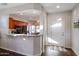 Kitchen entry with granite counter and view into kitchen at 17561 N Saddle Ridge Dr, Surprise, AZ 85374
