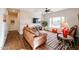 Spacious living room featuring leather furniture and hardwood floors at 17561 N Saddle Ridge Dr, Surprise, AZ 85374