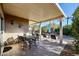 Covered patio with seating area and dining table at 17561 N Saddle Ridge Dr, Surprise, AZ 85374