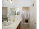 Bathroom with double sinks and a shower stall at 17824 W Addie Ln, Surprise, AZ 85374