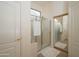 Bright bathroom with a shower and a large mirror at 17824 W Addie Ln, Surprise, AZ 85374