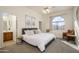 Spacious bedroom with a king-size bed and an ensuite bathroom at 17824 W Addie Ln, Surprise, AZ 85374