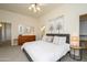 Main bedroom with a king-size bed and plenty of natural light at 17824 W Addie Ln, Surprise, AZ 85374