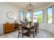 Charming dining room with wood table and window views at 17824 W Addie Ln, Surprise, AZ 85374