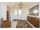Bright and airy entryway with tile flooring and wood console table at 17824 W Addie Ln, Surprise, AZ 85374