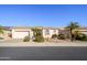 Single-story home with neutral exterior, landscaping, and a two-car garage at 17824 W Addie Ln, Surprise, AZ 85374