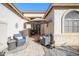 Relaxing front patio with seating and a stone walkway at 17824 W Addie Ln, Surprise, AZ 85374