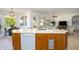 Kitchen island with sink, dishwasher, and storage at 17824 W Addie Ln, Surprise, AZ 85374